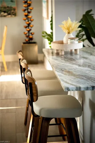 Dining area view of baseboards and wood finished floors