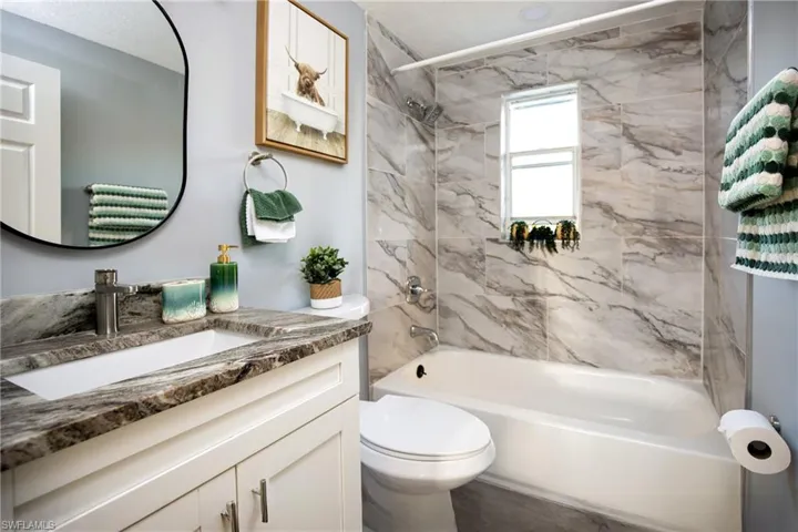 Full bathroom with vanity and shower / tub combination