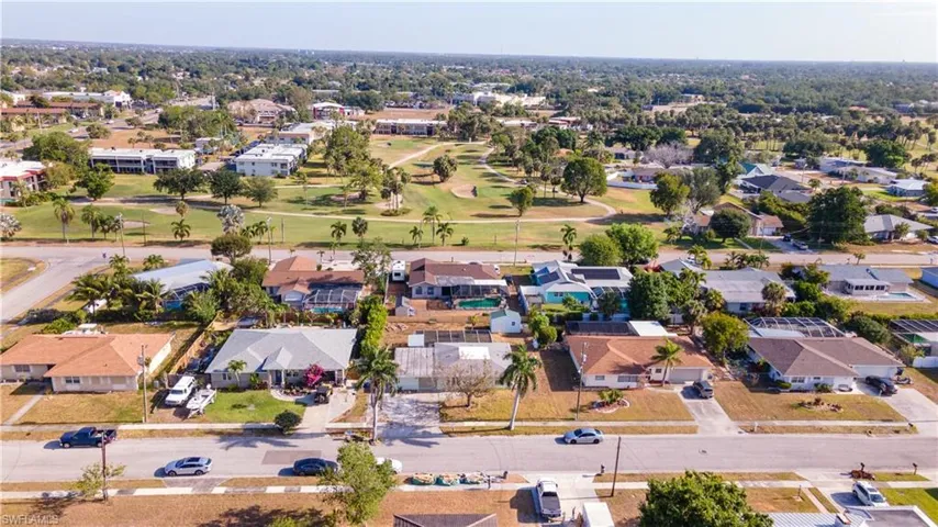 Drone / aerial view with a residential view and golf course view
