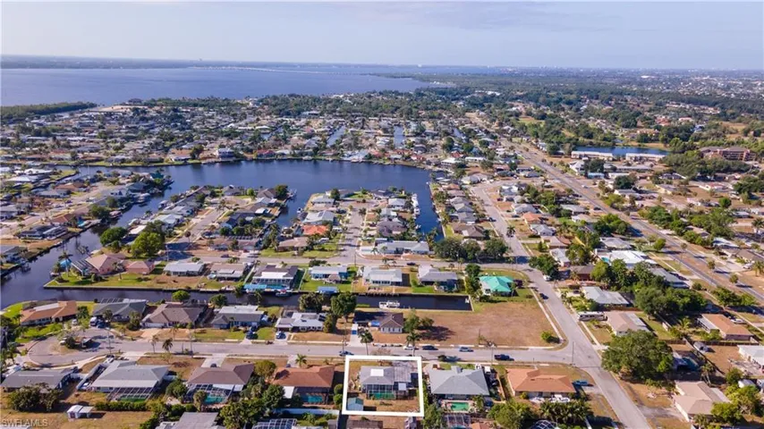 Aerial view with a water view and a residential view