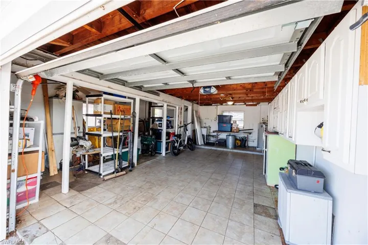 Garage featuring a garage door opener