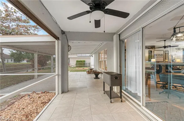 Sunroom featuring ceiling fan