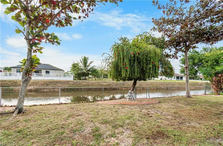 View of yard with a water view