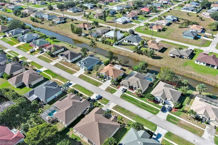 View of property location with nearby suburban area and a nearby body of water