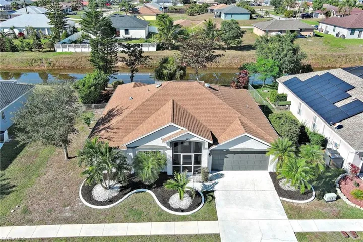 Aerial view of residential area with a large body of water