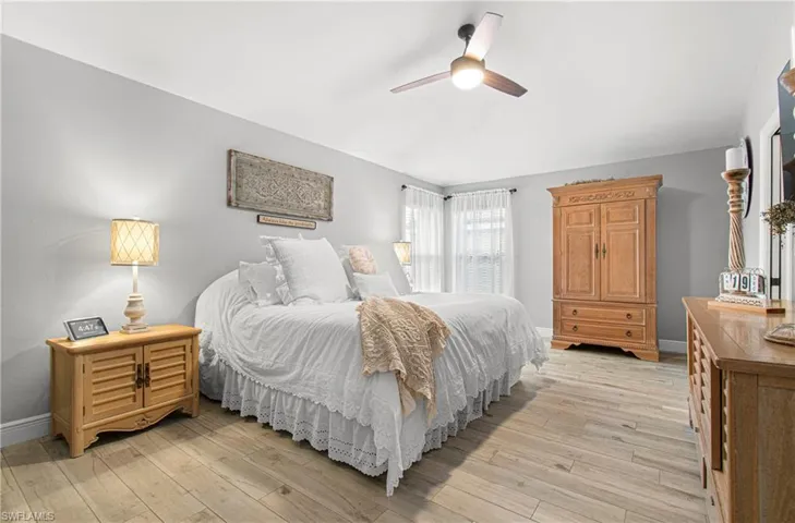 Bedroom featuring light wood-style floors and a ceiling fan