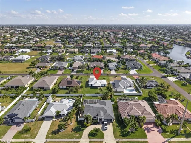 Aerial overview of property's location featuring nearby suburban area