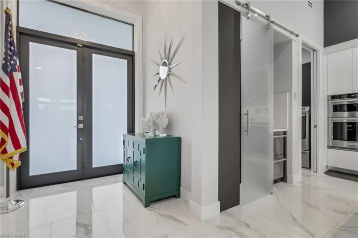 stunning double glass-door entry welcomes you into the spacious great room