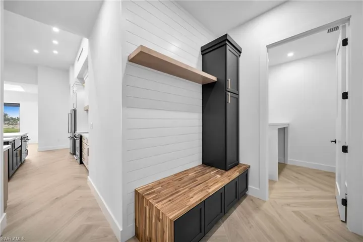 Mudroom featuring light parquet flooring
