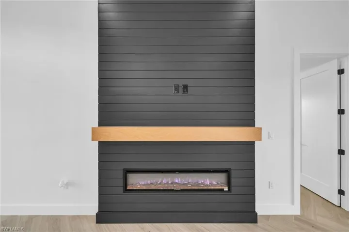 Interior details featuring a fireplace and hardwood / wood-style floors