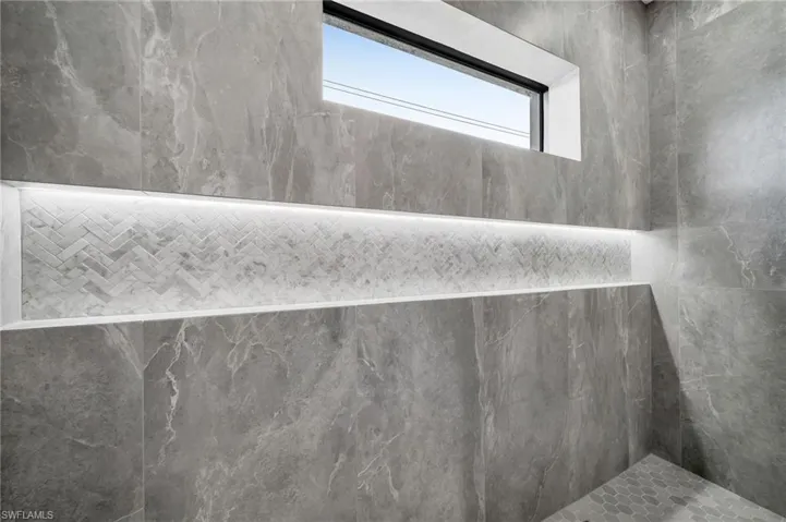 Details featuring tiled shower