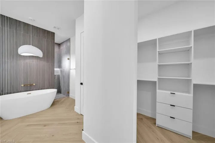 Bathroom featuring a tub to relax in