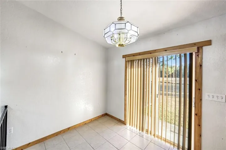 Dining area with sliding glass doors to lanai.