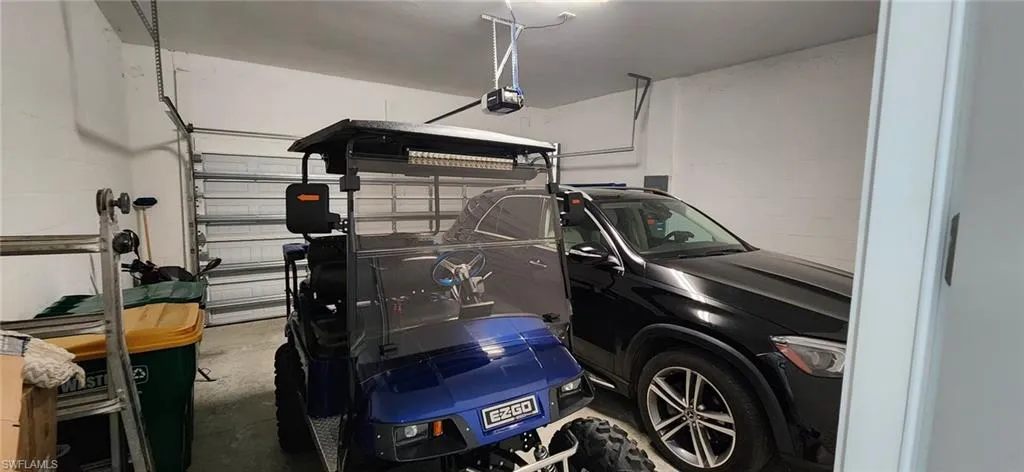 Garage featuring a garage door opener