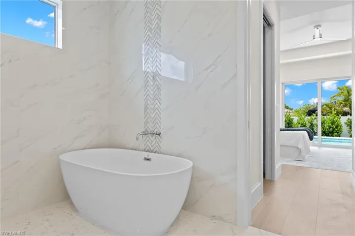 Bathroom featuring tile floors and tile walls