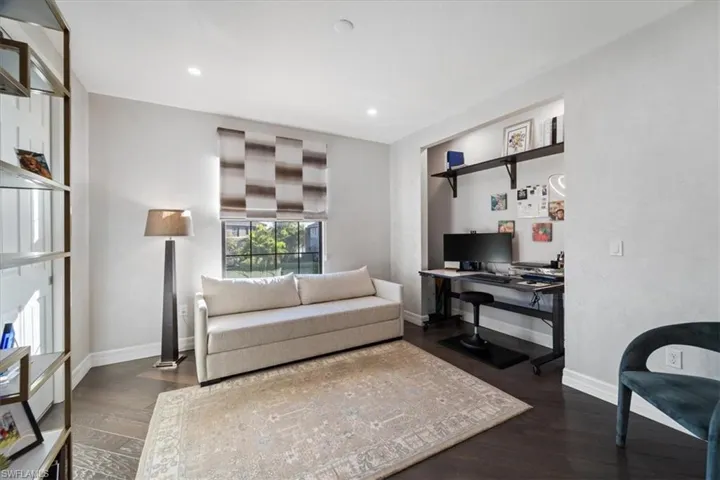 Home office featuring dark wood-type flooring