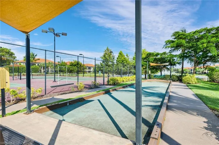 Surrounding community featuring tennis court