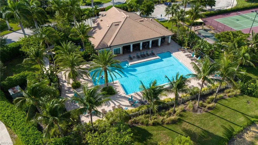 View of swimming pool featuring tennis court and a patio