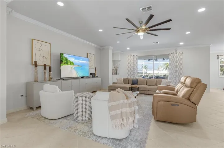 Tiled foyer featuring a chandelier and a wealth of natural light
