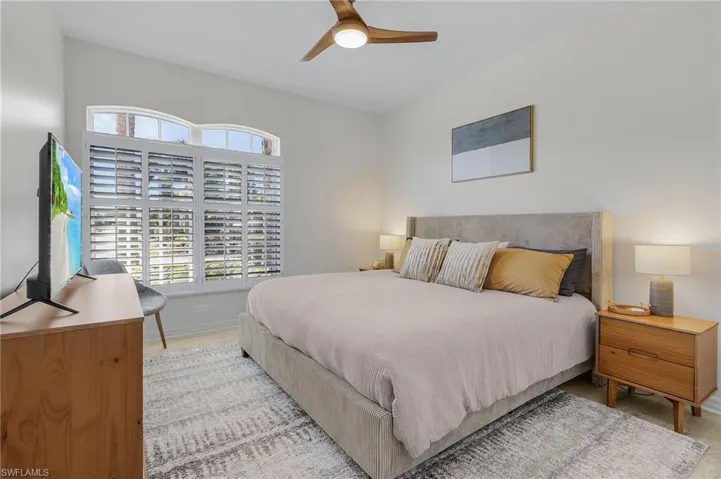 Bedroom featuring hardwood / wood-style flooring, ceiling fan, and a closet