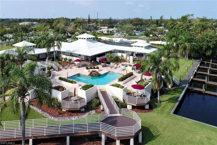 View of pool featuring a community hot tub and a patio