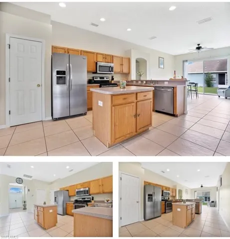 Kitchen with a center island, open floor plan, light tile patterned flooring, and recessed lighting