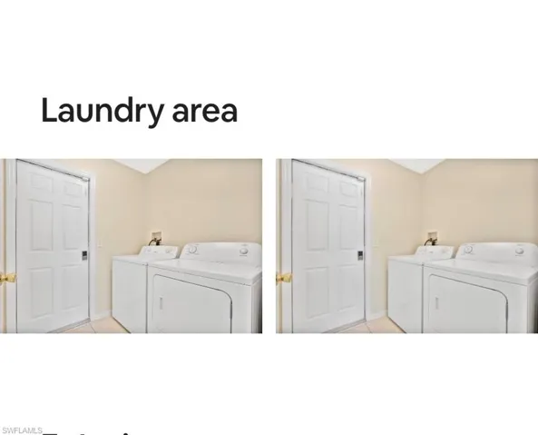 Laundry room with washer and dryer, light tile patterned floors, and vaulted ceiling