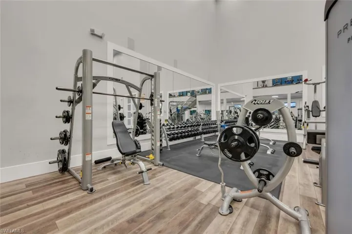 Workout area featuring wood-type flooring