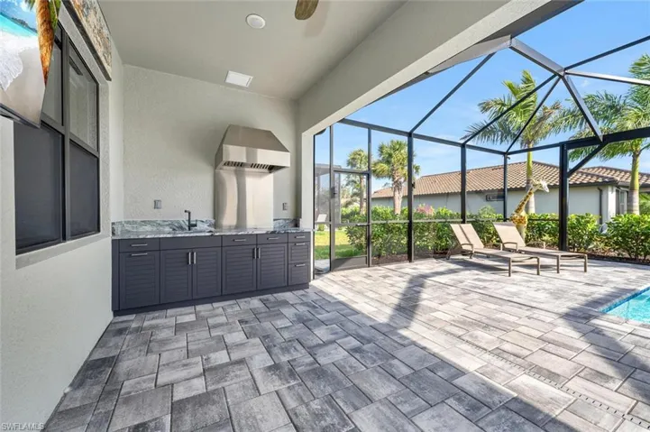 View of patio / terrace with a lanai and sink