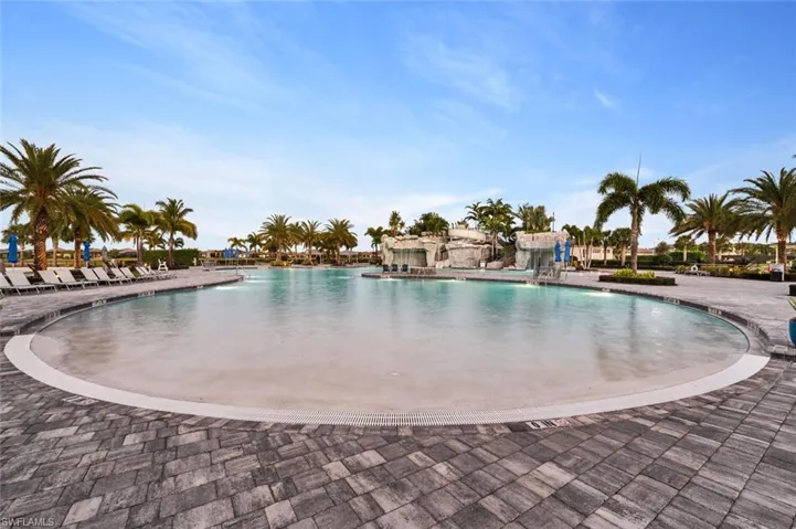 View of swimming pool featuring a patio and pool water feature
