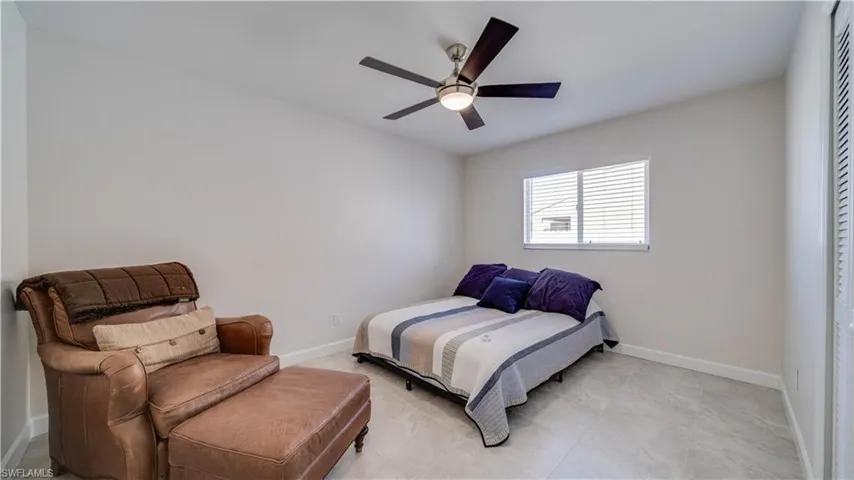 Guest Bedroom with tiled floors.  Furrniture is not included in this bedroom.