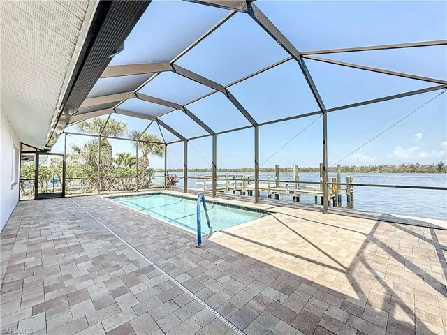 Swimming pool overlooking Estero Bay and boat dock/fishing pier