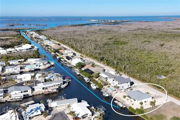 Aerial view of residential area with a large body of water