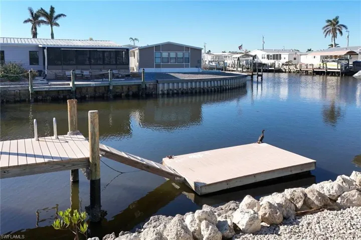 Dock area featuring a water view and a residential view