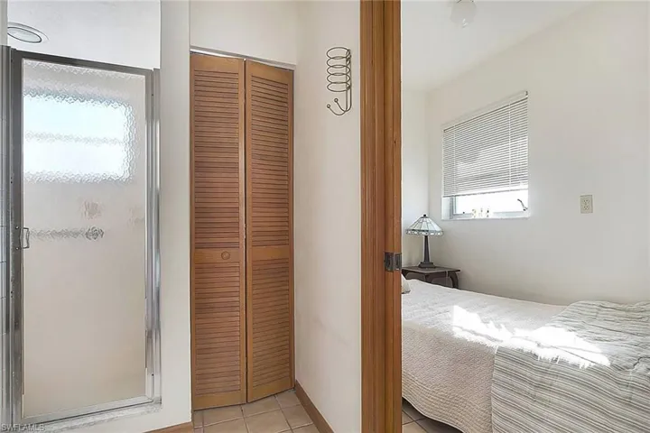 Bedroom featuring a closet and light tile patterned floors