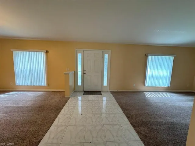 View of carpeted entrance foyer