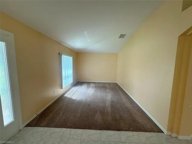 Spare room with tile patterned floors