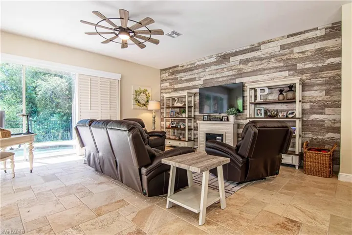 Enjoy the stylish "shiplap"  wall in addition to the irresistible charm of the "faux" fireplace.