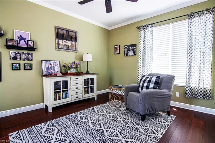 This guest bedroom 1 is currently furnished as a relaxing sitting room space for the second floor.