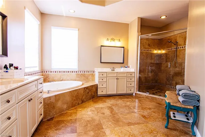 Large ensuite master bathroom includes two vanities and a healthy dose of sunlight!