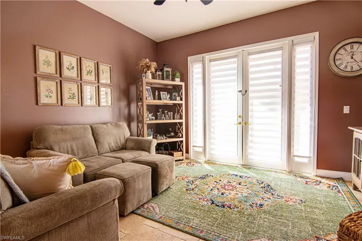 This room currently functions as a relaxing sitting room for the first floor. The classic French Doors with Sidelights provide lots of natural lighting!