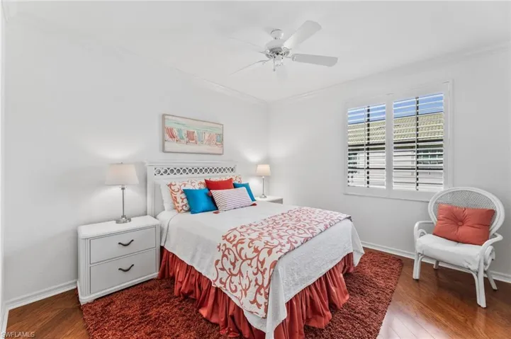 The first Guest Bedroom provides a tranquil space for your guests to enjoy, complete with crown molding, a spacious closet and hardwood flooring.