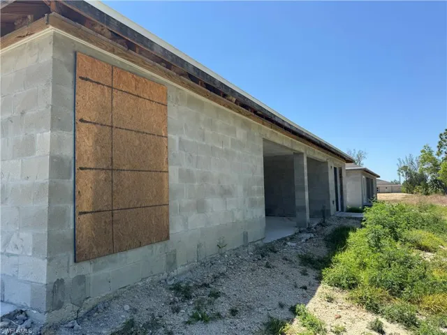 View of home's exterior with concrete block siding