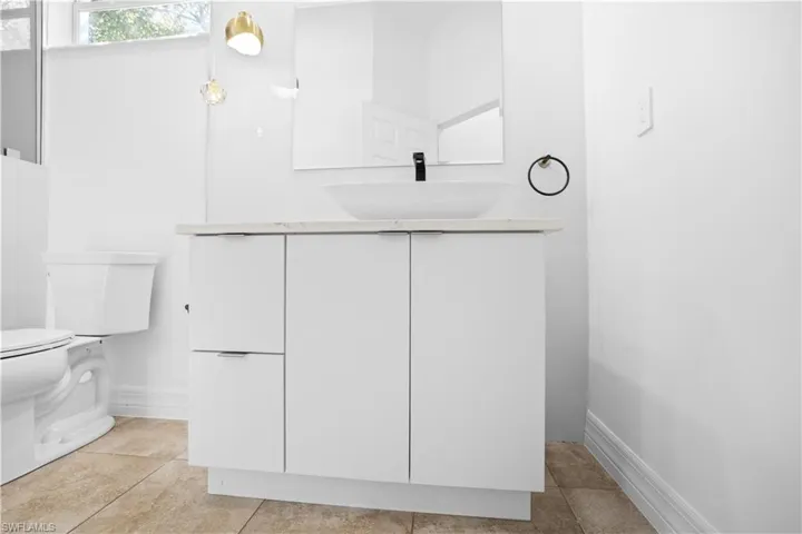Bathroom featuring vanity and light tile patterned floors
