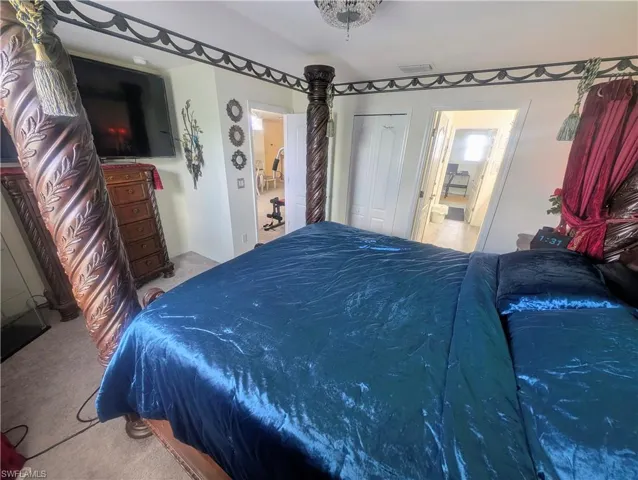 Carpeted 2nd floor bedroom with a Jack and Jill bathroom