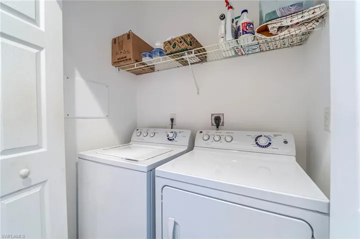 Washroom featuring independent washer and dryer