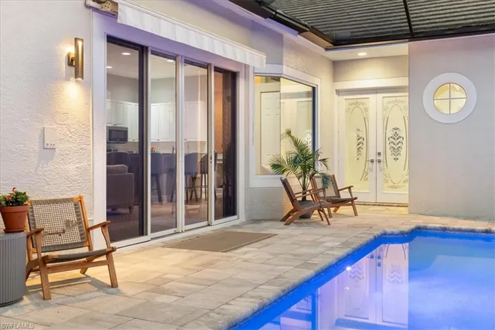 Pool featuring french doors