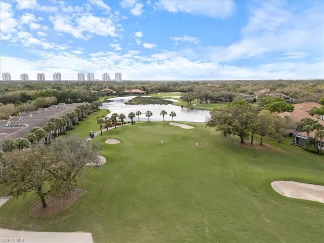 Drone / aerial view with a water view, a view of city, and golf course view