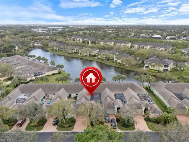 Aerial view featuring a water view and a residential view
