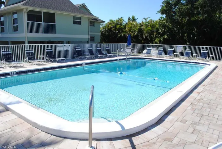 Community pool featuring a patio area